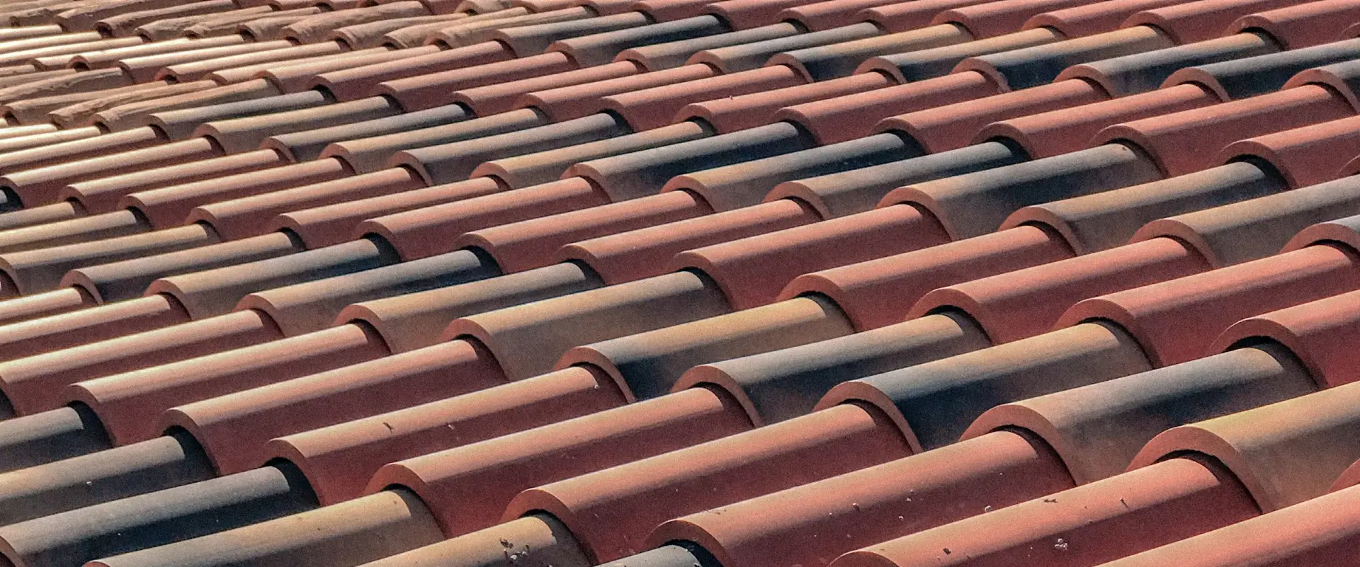 Professional roofer repairing a residential roof in London