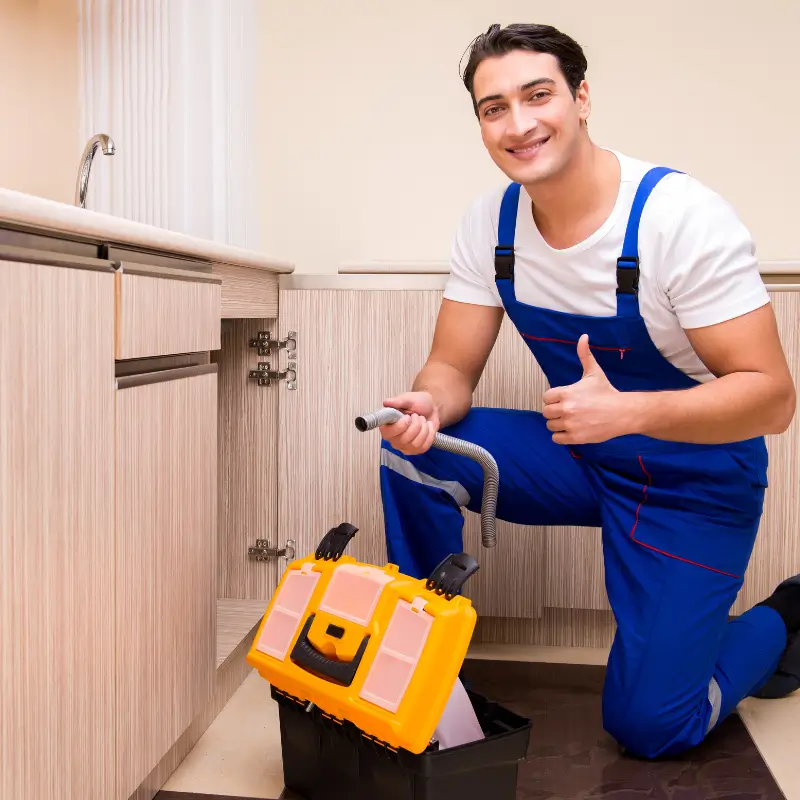 Plumber fixing sink