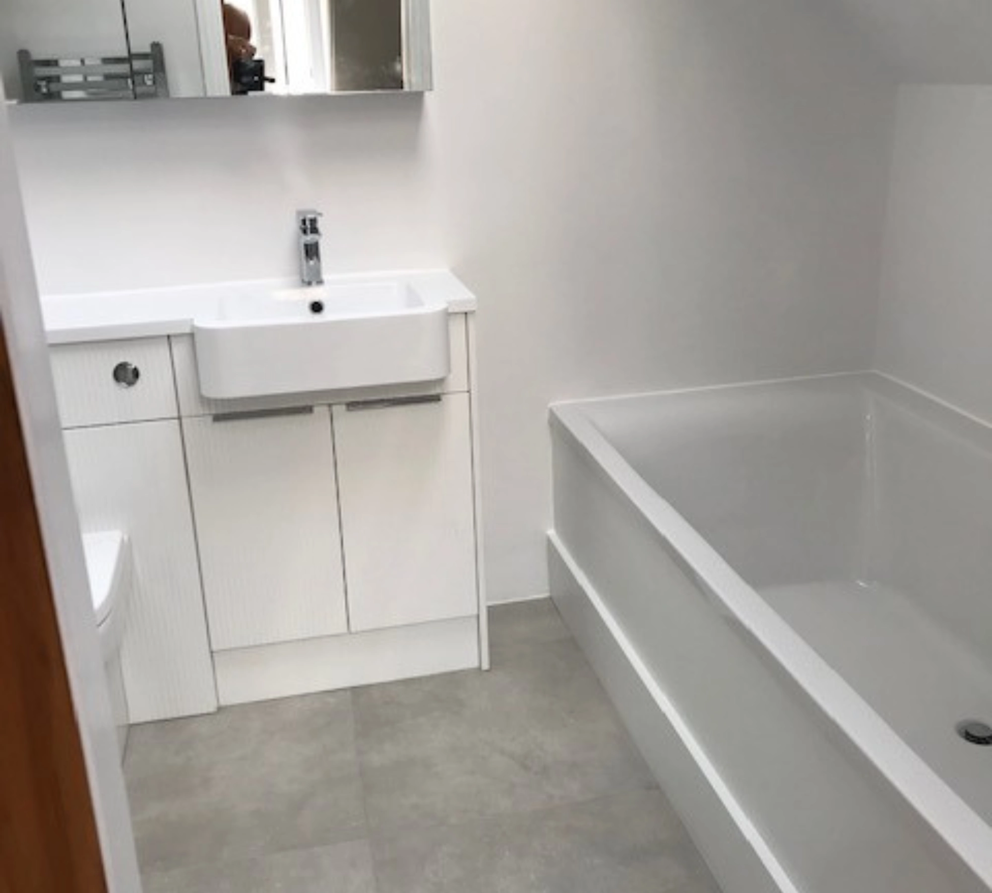 White bathroom with built-in tub