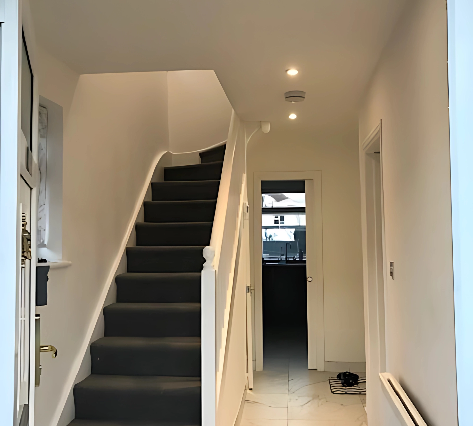 Staircase with gray carpet