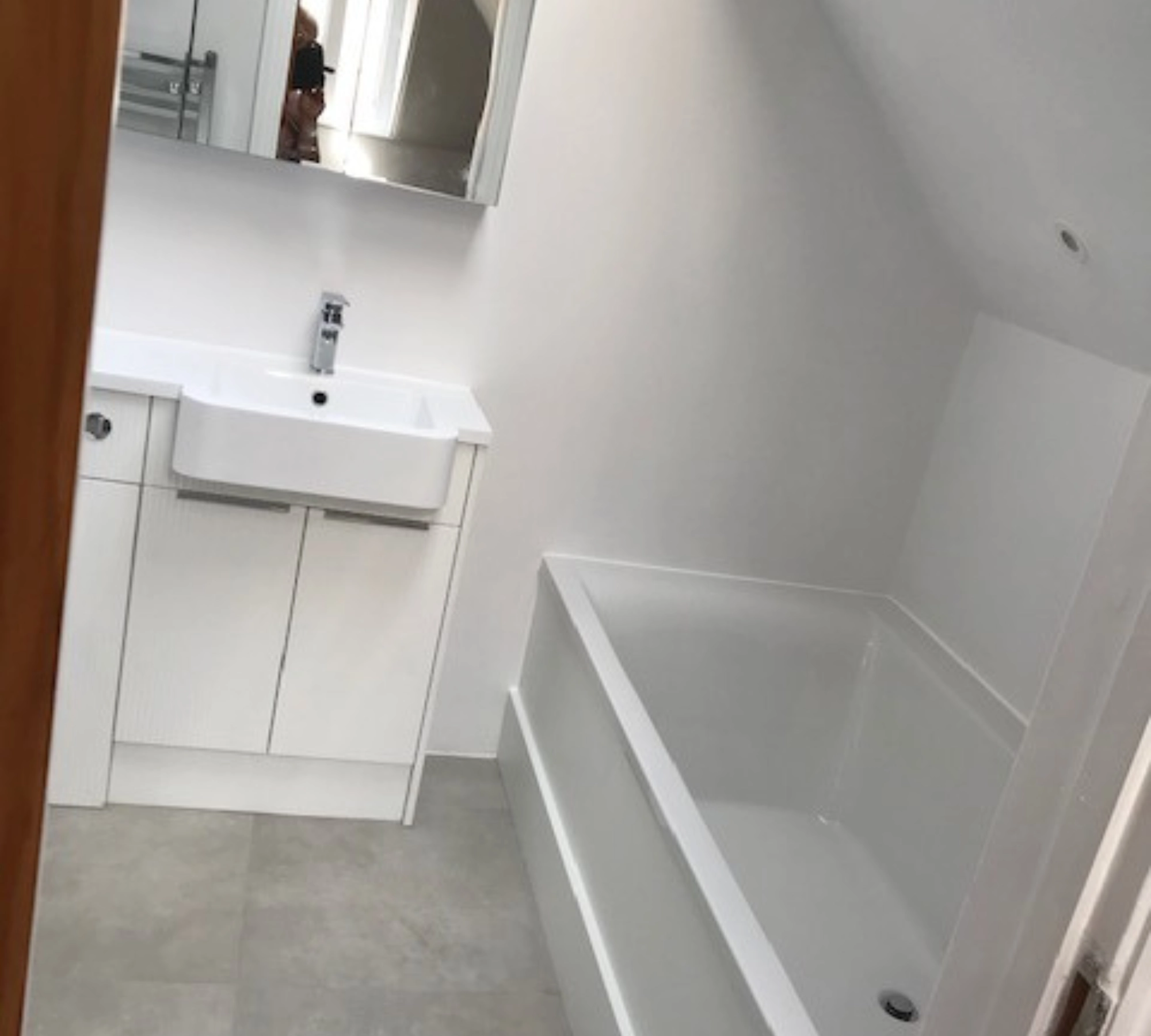 White bathroom with bathtub